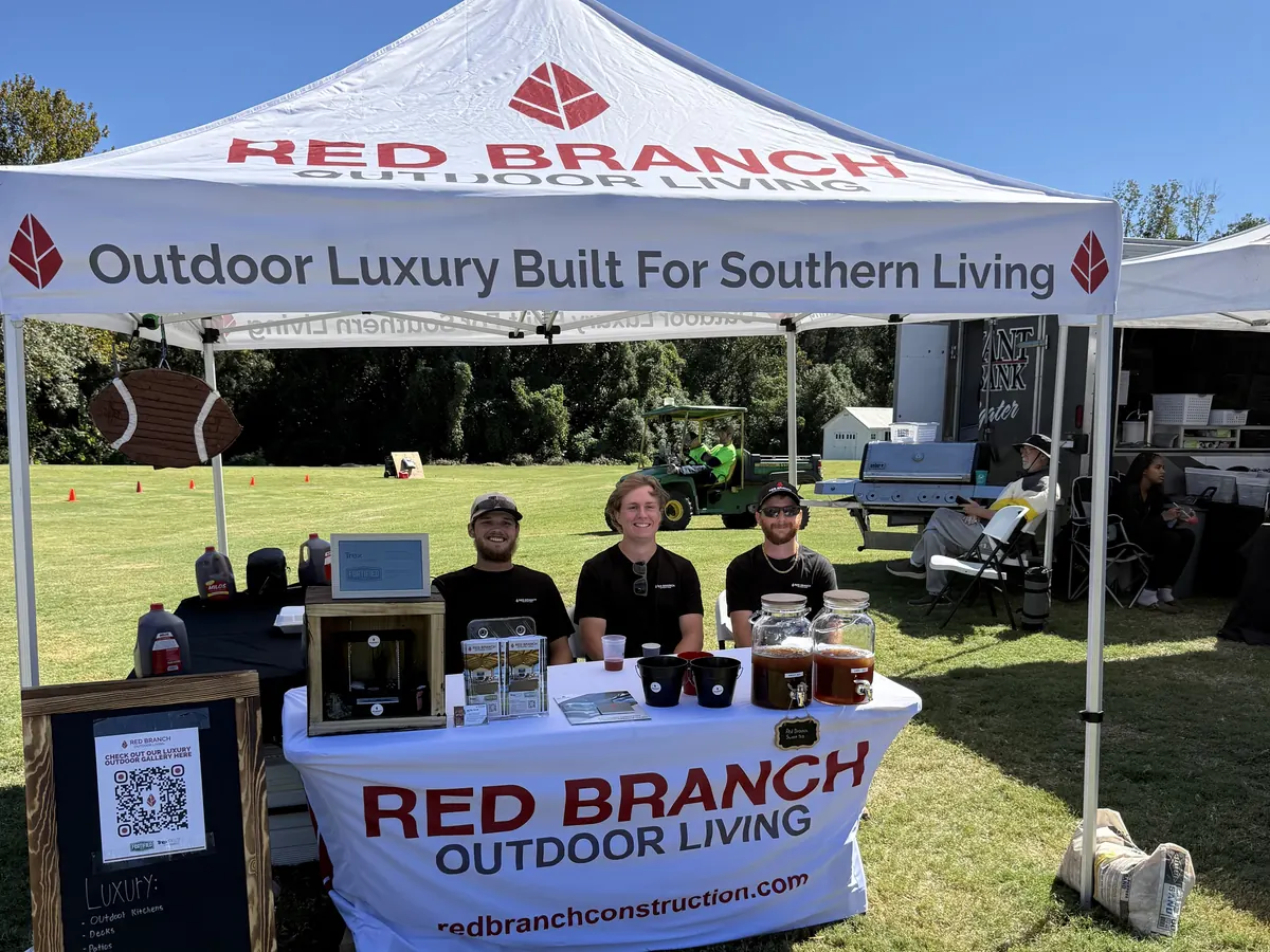 Red Branch Outdoor Living team at a local community event booth, Gulf Coast AL
